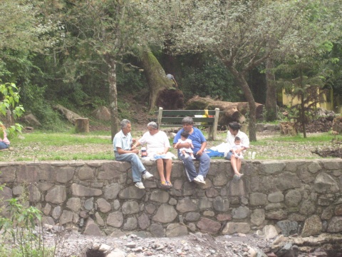 We enjoyed watching this family share <I>mate</I> while their boys (not pictured) attempted to throw every stone into the water.
